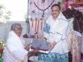 Dr.Umar Alisha distributing saree to poor women  on the occasion of 18thAnniversary of Bheemili Ashram