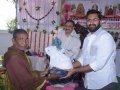 Sri M.Bharat (Geetham Institutes Chairman, Vishakapatnam) distributing saree and rice to poor women  on the occasion of 18thAnniversary of Bheemili Ashram