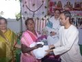 Sri S V Satyanarayana , Vedhantha Institute chairman (Vishakapatnam ) distributing saree and rice to poor women  on the occasion of 18thAnniversary of Bheemili Ashram