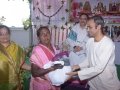 Sri S V Satyanarayana , Vedhantha Institute chairman (Vishakapatnam ) distributing saree and rice to poor women  on the occasion of 18thAnniversary of Bheemili Ashram