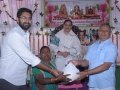 Sri M.Bharat (Geetham Institutes Chairman, Vishakapatnam and Sri S.Veerabhadra Rao , Editor of Visakha Samacharam distributing saree and rice to poor women  on the occasion of 18thAnniversary of Bheemili Ashram