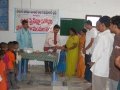 Dr. Umar Alisha, Chairman UARDT, giving Swine Flu preventive medicine to a child at Pithapuram on 27-Aug-2009
