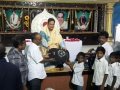 Dr.Umar Alisha, UARDT chairman, ​distributing school bags to 125 students of R.R.BH.R BC boys hostel pithapuram on the occasion of Guru Pournami at Sri Viswa Vizanan Aadhyatmika Peetham new Ashram Premises