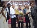 Dr Umar Alisha receiving Savitri Bhai Phule Life Time Achievement Award