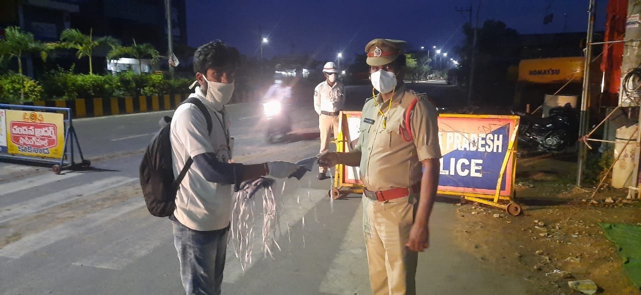 UARDT distributed Coronavirus preventive Homeo medicine and Masks at Yanam Road, Kakinada on 28-Apr-2020
