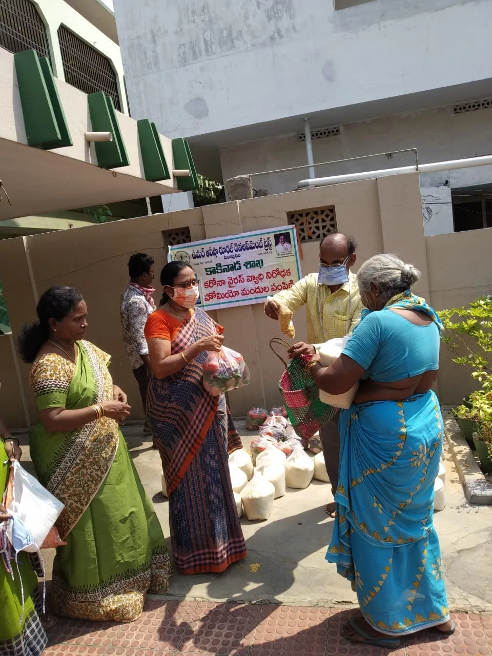 UARDT distributed Coronavirus preventive Homeo medicine, masks, groceries, vegetables at Madhura Nagar, Kakinada on 03-May-2020